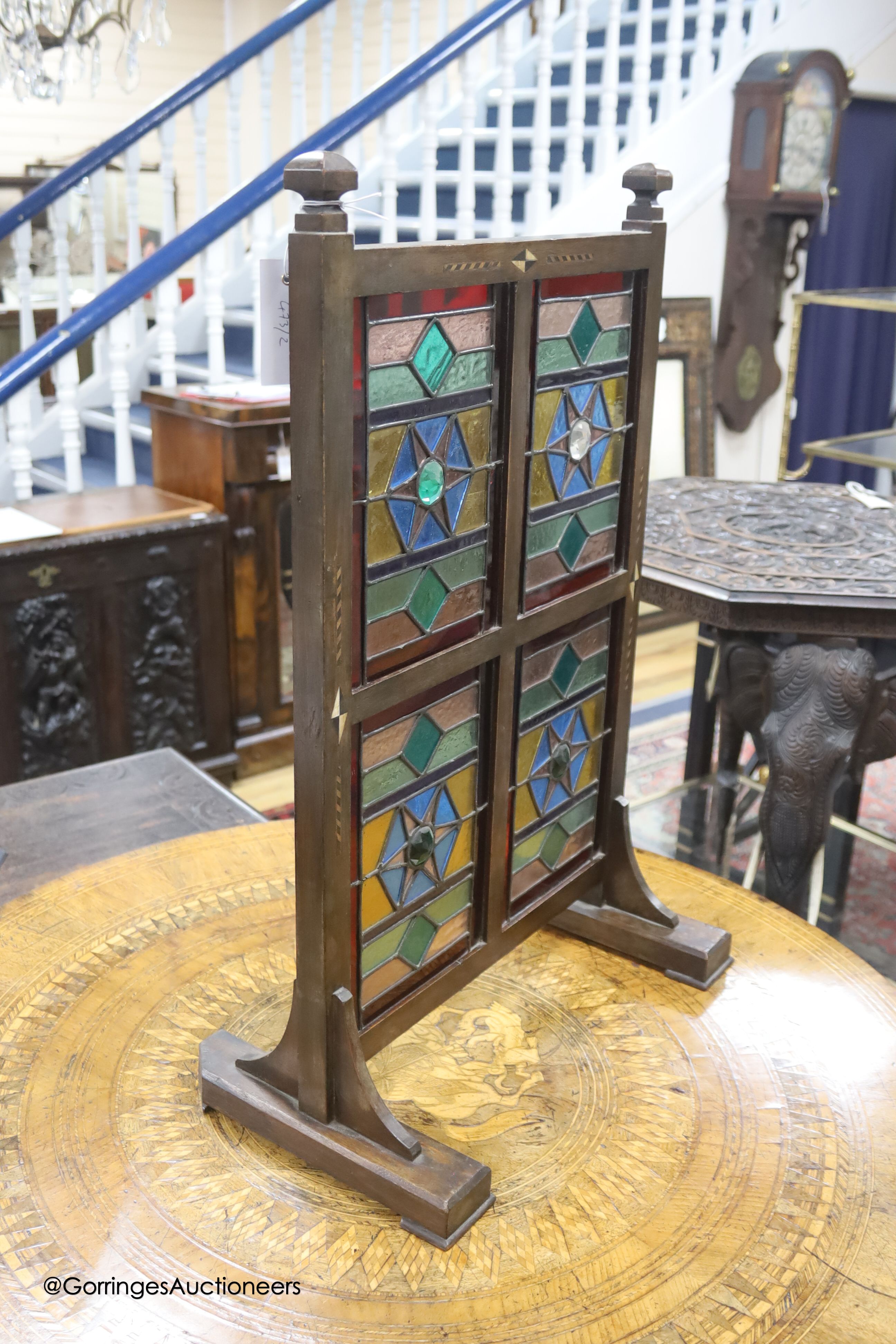 An Edwardian Liberty & Co. stained glass and beech leaded glass room screen, width 43cm, height 67cm